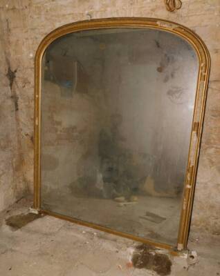 A Victorian gilt plaster overmantel mirror, with arched rectangular plate, 158cm high, 138cm wide.