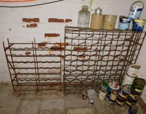 Two wrought iron wine racks, the left 64 bottle, the right 144 bottle.