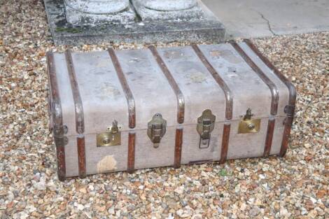 A metal and wooden bound canvas cabin trunk, with brassed mounts, leather side handles, 36cm high, 92cm wide, 54cm deep.