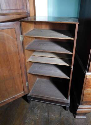 An early 19thC mahogany folio cabinet, the top with a moulded edge and a single panelled door enclosing shelves on square tapering legs, (AF), 105.5cm high, 51cm wide, 34.5cm deep. - 2