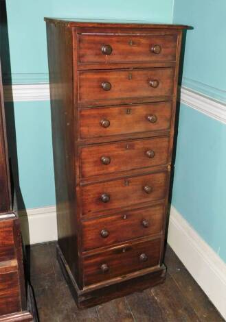 An early Victorian mahogany pedestal chest of drawers, the top with a moulded edge above seven drawers each with turned wood handles on a plinth base, 121cm high, 46cm wide, 41cm deep. (AF)