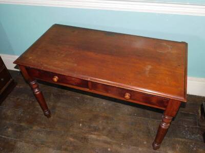 An early Victorian mahogany side table, the top with a moulded edge above two frieze drawers each with turned wood handles, on turned tapering legs, 71cm high, 109cm wide, 54cm deep. - 2