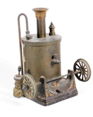 A late Victorian brass and iron model standing live steam engine, lacking burner, 16cm high.