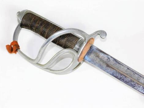 An Edwardian officer's dress sword by Wilkinson of Pall Mall, with engraved fullered blade and chequered grip, blade 89cm, and with leather bound scabbard.