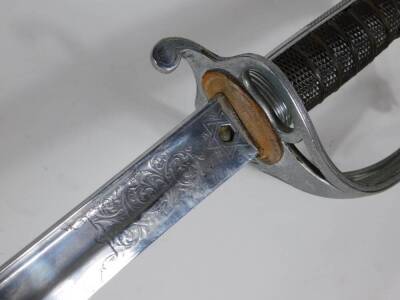 An Edwardian officer's dress sword by Wilkinson of Pall Mall, with engraved fullered blade and chequered grip, blade 89cm, and with leather bound scabbard. - 6