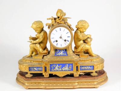 A 19thC French ormolu and Paris porcelain figural mantel clock, with enamel dial marked Howell & James, Paris, signed on the back plate and numbered 680, on a contemporary gilt wood stand, the clock being 29cm high, 39cm wide.