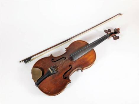 A 19thC German violin, with two piece back and rosewood pegs, (lacking bridge), bears a label to the interior inscribed "Reparavit Jos Engleder Instrumentenmacher In Kehlheim 18..", and a violin bow.