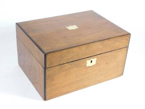 A Victorian walnut workbox, with inset corners, a blank cartouche to the lid with a silk lined interior, 28cm x 20.5cm x 15cm and contents.