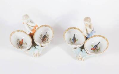 A pair of early 19thC KPM Royal Berlin porcelain double salt stands, with putti figures and hand decorated with polychrome enamel birds, underglaze blue septre mark to base, 13cm high. - 2