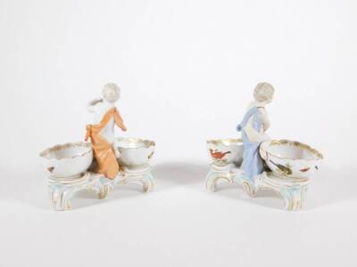 A pair of early 19thC KPM Royal Berlin porcelain double salt stands, with putti figures and hand decorated with polychrome enamel birds, underglaze blue septre mark to base, 13cm high. - 3