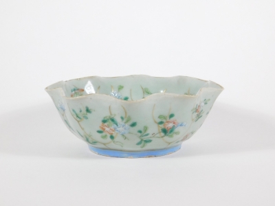 A 19thC celadon glazed Chinese porcelain bowl enamelled with peony branches, with wavy edge and six character Tongzhi seal mark to base and probably of the period (1862 - 1874), 17cm diameter. - 3