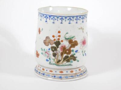 An 18thC Chinese porcelain baluster tankard, painted in enamels with peonies and fruit, 15cm high. (AF - repaired handle) - 2