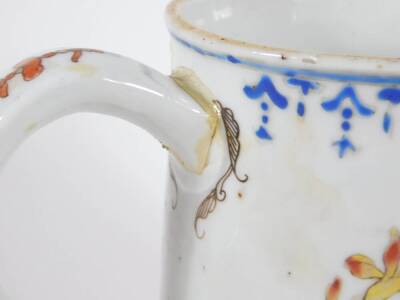 An 18thC Chinese porcelain baluster tankard, painted in enamels with peonies and fruit, 15cm high. (AF - repaired handle) - 4