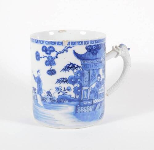 An early 19thC Chinese blue and white porcelain pallet mug, handpainted with landscape, boats, figures, and pagodas, 14cm high. (AF - loss to foot of handle, two chips to the rim)