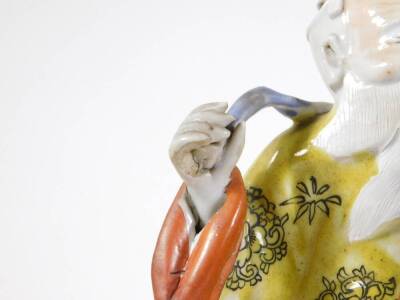 A 19thC Chinese polychrome porcelain figure of a bearded sage, dressed in a yellow robe, 27cm high. - 4