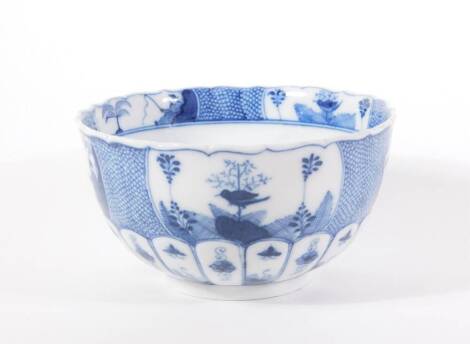 A 19thC blue and white porcelain bowl, moulded and decorated in the Chinese style and having cross sword mark to base, 17cm diameter.