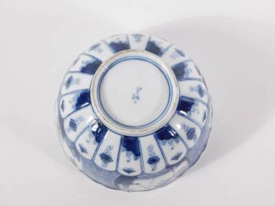 A 19thC blue and white porcelain bowl, moulded and decorated in the Chinese style and having cross sword mark to base, 17cm diameter. - 3