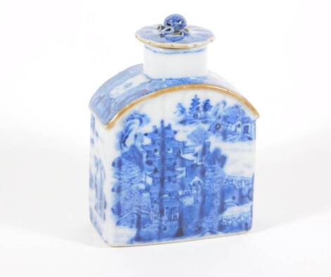 A 18thC blue and white porcelain tea canister and cover, handpainted with buildings and landscape, 13cm high.