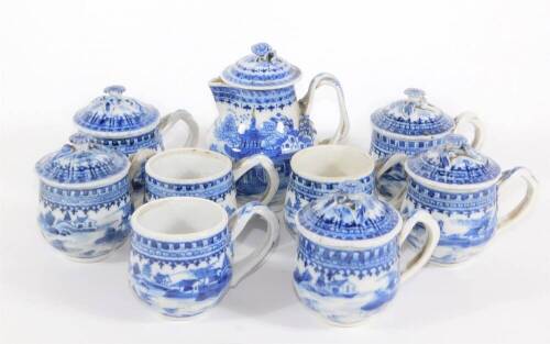 A group of 18th/19thC Chinese blue and white porcelain tablewares, comprising lidded sparrow beak jug, eight consomme cups with strap handles and five covers.