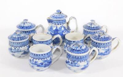 A group of 18th/19thC Chinese blue and white porcelain tablewares, comprising lidded sparrow beak jug, eight consomme cups with strap handles and five covers.