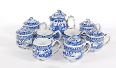 A group of 18th/19thC Chinese blue and white porcelain tablewares, comprising lidded sparrow beak jug, eight consomme cups with strap handles and five covers. - 2