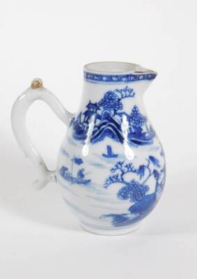 An early 19thC Chinese blue and white porcelain milk jug, with loop handle and sparrow beak spout, 11cm high. - 2