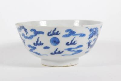 A late 19thC Chinese blue and white porcelain bowl, with four claw celestial dragon and four character mark to base, 12cm diameter. (AF - hairline crack) - 3