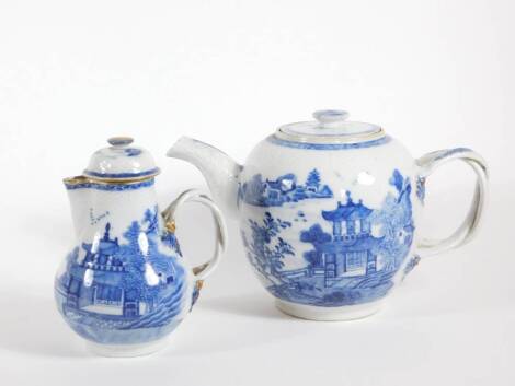 An early 19thC blue and white teapot, with double loop handle, basket moulded cover and neck, pagoda scenes to the side and a similar milk jug and cover, 15cm and 13cm high. (2)