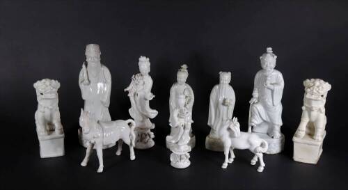 A group of 19thC and later Chinese Blanc De Chine figures, of temple dogs, horses and court figures, highest being 22cm. (10, some AF)