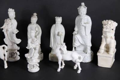 A group of 19thC and later Chinese Blanc De Chine figures, of temple dogs, horses and court figures, highest being 22cm. (10, some AF) - 3