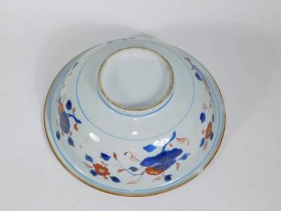 An 18thC Chinese porcelain bowl, with landscape and fisherman in central reserve in Imari colours, 26cm diameter. (AF - two losses to underside of the rim and hairline crack to body) - 3