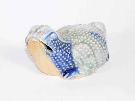 A 19thC Oriental celadon and blue glazed figure of a toad, 13cm long.