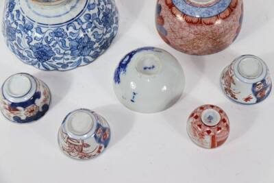Six various 18th and 19thC Japanese porcelain bowls, and a Chinese blue and white stem cup wit scrolling peony designs, 15cm diameter down. - 3