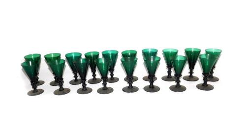 A set of eighteen Victorian green conical glasses, with knopped stems and plain circular feet, approximately 13cm high.