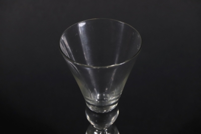 An 18thC wine glass, the plain thistle bowl with solid base and air mushroom knop to the stem, on a folded foot, 17cm high. - 3