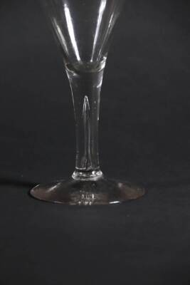 An 18thC wine glass, with trumpet bowl and tapered air stem, 16.9cm high. - 2