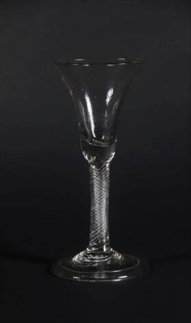 An 18thC wine glass, with bell shaped bowl and air twist stem on a folded foot, 18.3cm high.