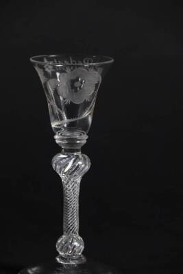 A pair of mid 18thC Jacobite wine glasses, with engraved thistle bowls, each having a white rose and buds and inscribed 'Redeat' with a star, on double knopped air twist stems, 14.7cm and 15cm high. - 5