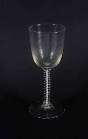 A large 18thC wine glass, with round funnel bowl on a double opaque twist stem, 21cm high.