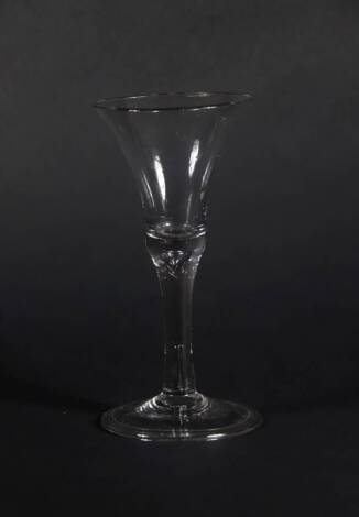 An 18thC wine glass, with bell shaped bowl and double air twist stem on a folded foot, 17cm high.