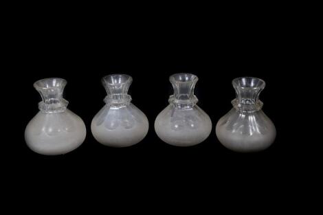 Four Victorian carafes, with slice cut necks and collars and conical semi-frosted bodies, with star cut bases, 13.5cm high.