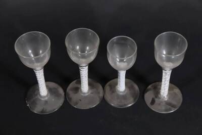 Four similar 18thC wine glasses, with plain bowls and double opaque twisted stems, raised on circular feet, ranging from 12.5cm to 14.2cm high. - 4