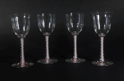 A pair of 18thC style wine goblets, (possibly by Stuart Crystal) with campana shaped bowls, on double opaque twisted stems, and plain circular feet, and another pair of similar glasses with plain rounded bowls and similar stems and feet, 21.5cm high and 2