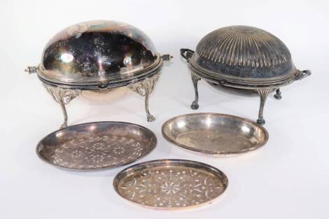 A Victorian crested silver plated oval serving dish, with roll over hinged lid, and inner liner, with beaded border and supported on four lions head and scroll legs with claw feet, another similar oval serving dish with fluted roll over lid and two additi