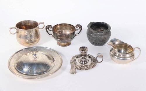 A late Victorian silver porringer type sugar bowl, with two ring handles, London 1900, an Edwardian two handled silver prize cup, Chester 1907, a plain circular silver cream jug, Birmingham 1919, and a small collection of other silver and silver plated it