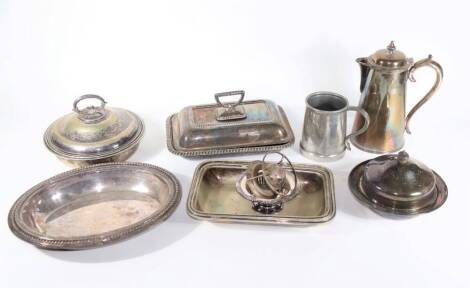 Four silver plated entree dishes, a silver plated muffin dish, an Elkington silver plated hot water jug of conical form, etc.