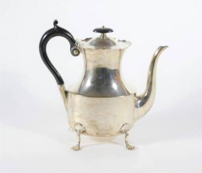 A late Victorian silver coffee pot, with everted wavey border and waisted oval body with query handle, raised on four stylized feet, London 1900, makers: Goldsmiths and Silversmiths Company Ltd, 18.5oz all in. - 2