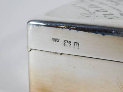 An Edwardian silver table cigarette box, of plain slightly domed rectangular design with hinged lid inscribed 'Presented to N E Little Esq by Members of Old Cleave Village Club...January 1929', London 1905, 18cm x 16cm x 4cm. - 3