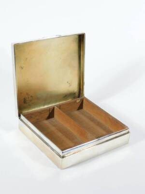 An Edwardian silver table cigarette box, of plain slightly domed rectangular design with hinged lid inscribed 'Presented to N E Little Esq by Members of Old Cleave Village Club...January 1929', London 1905, 18cm x 16cm x 4cm. - 4