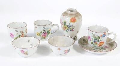 A group of London decorated Chinese porcelain, c.1740/60, including tea caddy, three coffee cups, two tea bowls and saucers decorated with flowers and sprays. (a quantity)